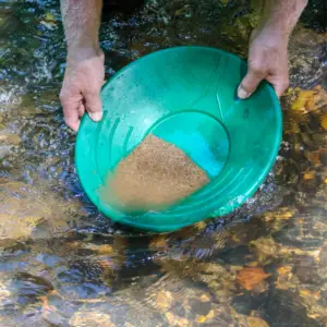 How do you pan for gold in small creeks